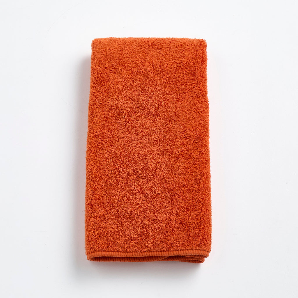 Serviette d'invité en coton orange citrouille