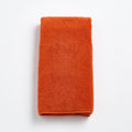 Serviette d'invité en coton orange citrouille